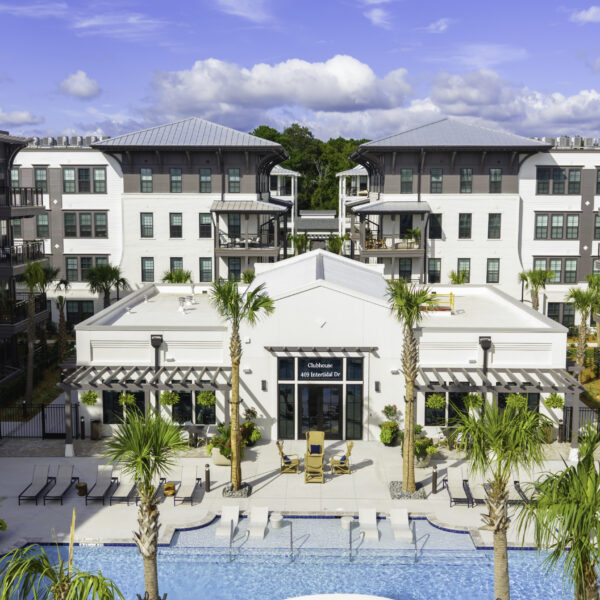Aerial view of the expansive pool deck at Atlantic Nowell Creek with residents relaxing poolside