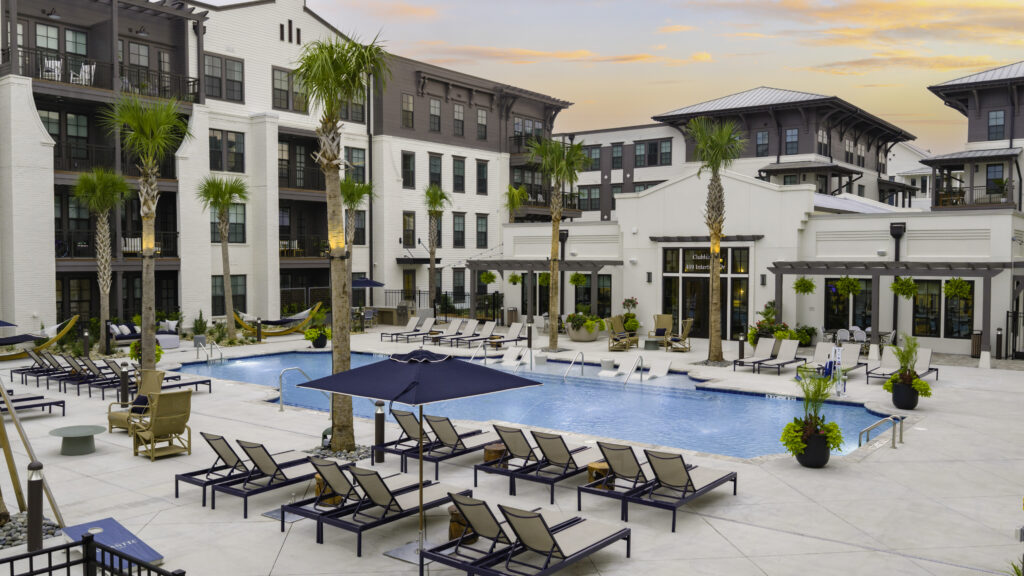 Resort-style pool deck with palm trees