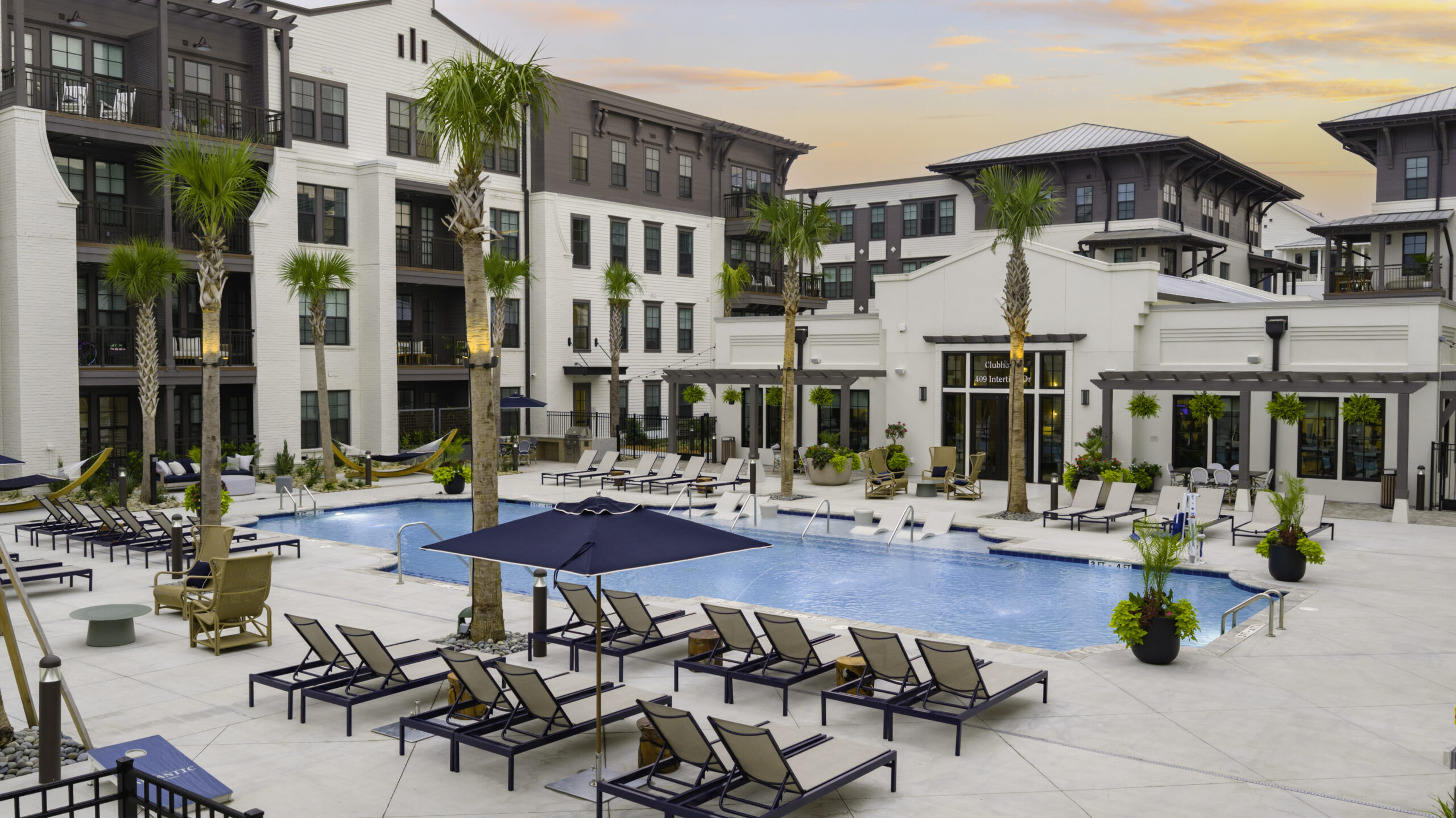 Resort-style pool deck with palm trees