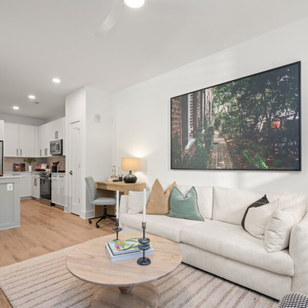 Cozy living room with a white sofa, accent chair, wood coffee table,