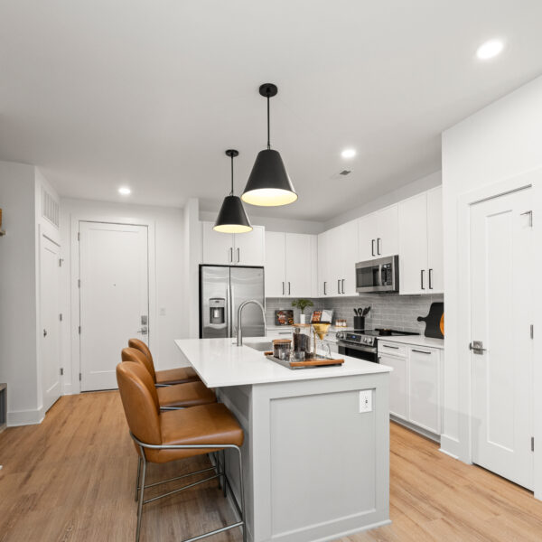 Kitchen with white counters and stainless steel appliances