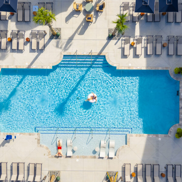 Aerial view of the pool at Atlantic Nowell Creek with residents relaxing poolside